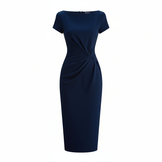 Woman wearing a navy blue dress holding a matching handbag against a neutral background