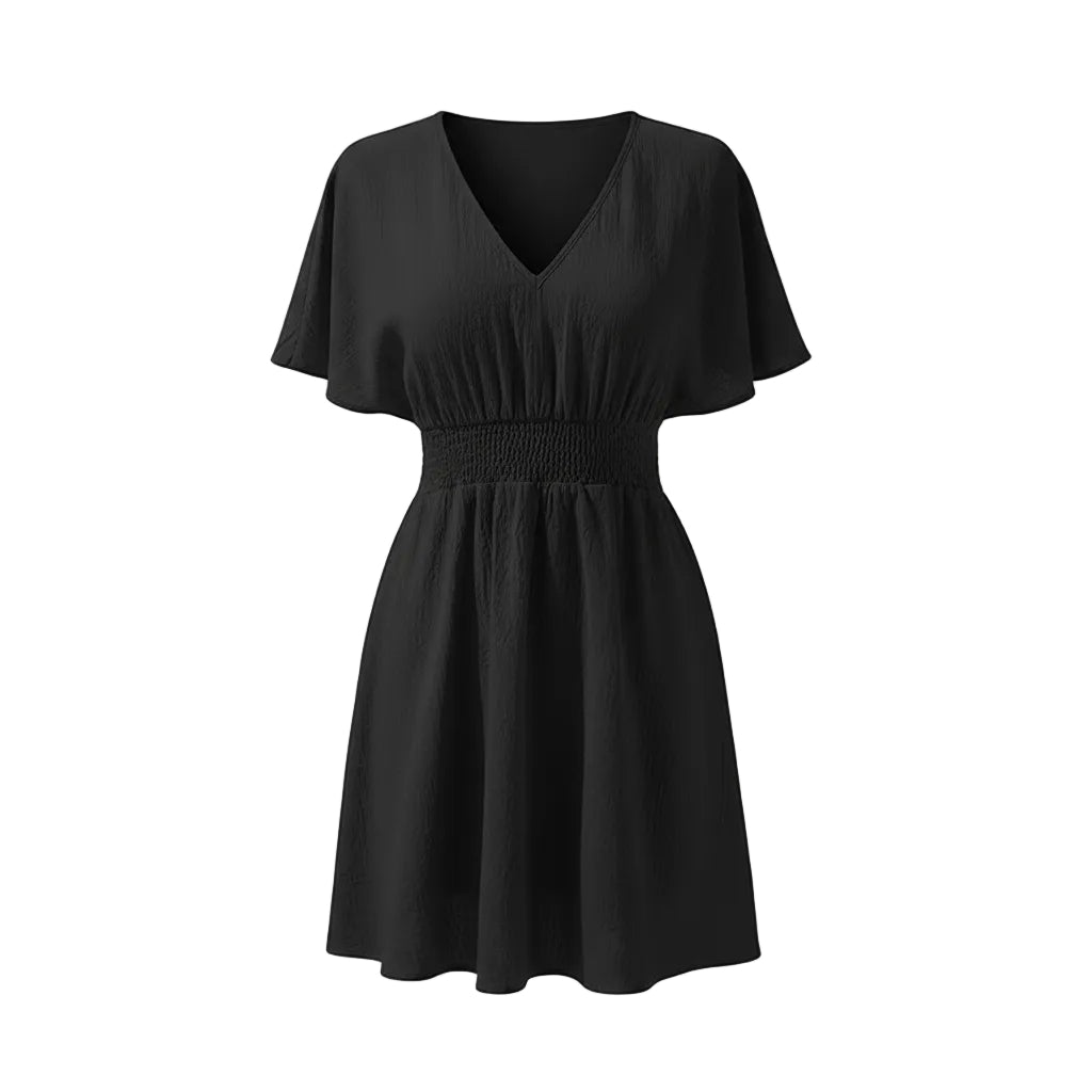Black dress worn by a model on a white background