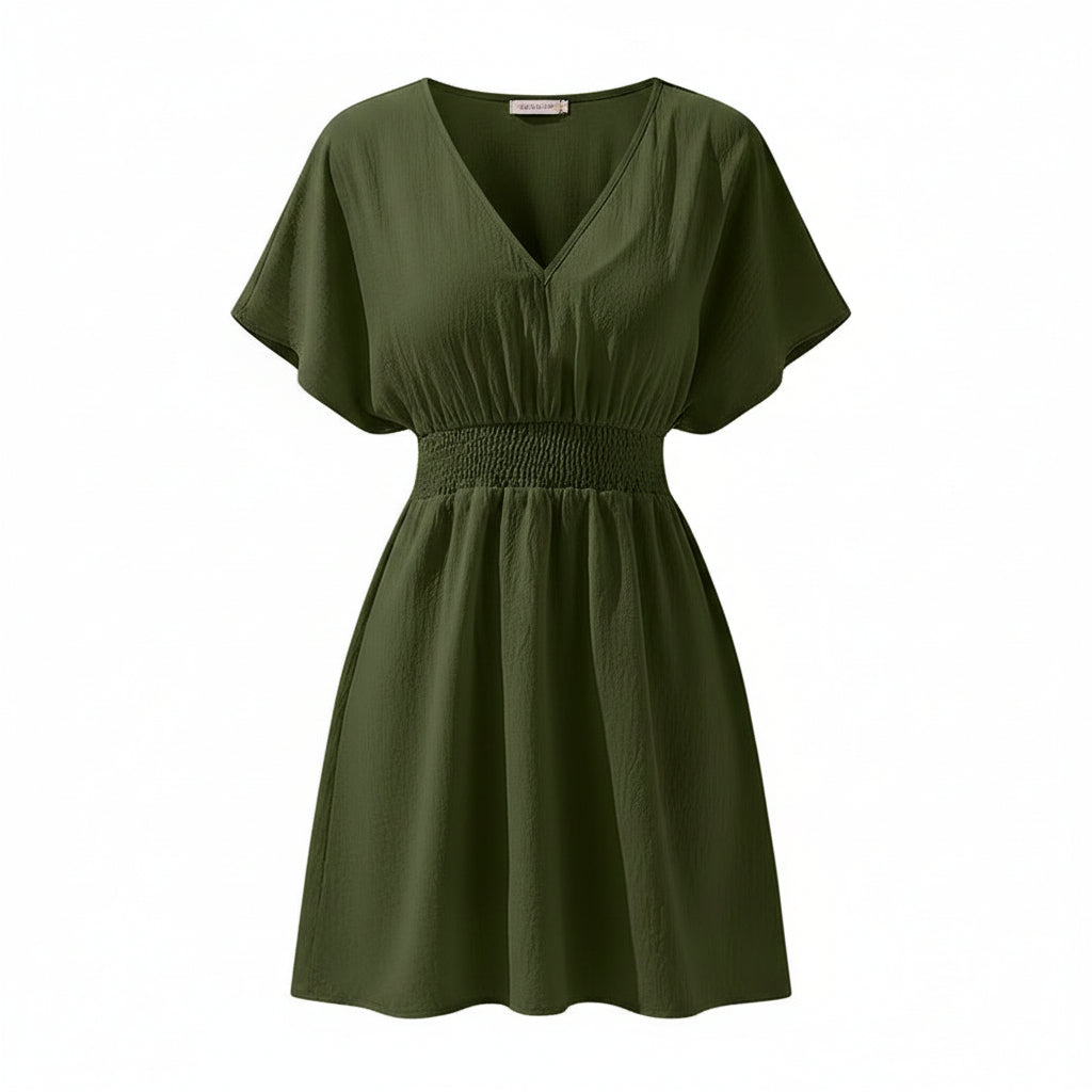 Woman wearing a green dress on a white background