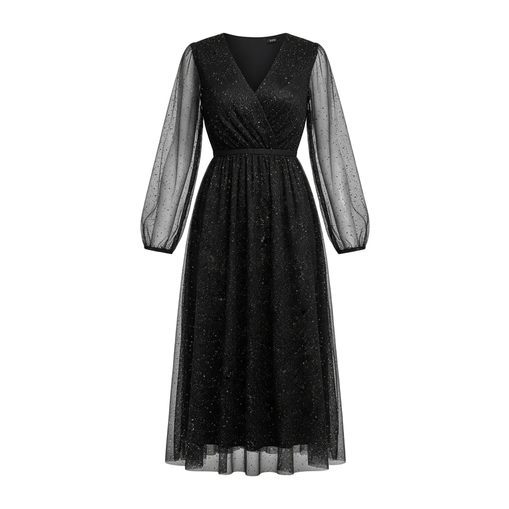Woman wearing a black sparkly dress with sheer sleeves in a festive indoor setting.