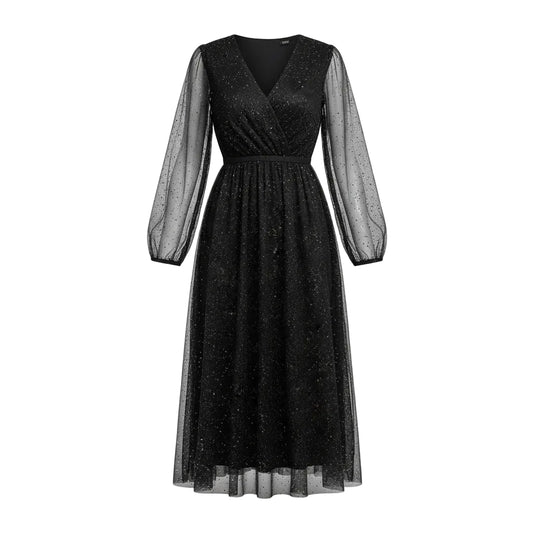 Woman wearing a black sparkly dress with sheer sleeves in a festive indoor setting.