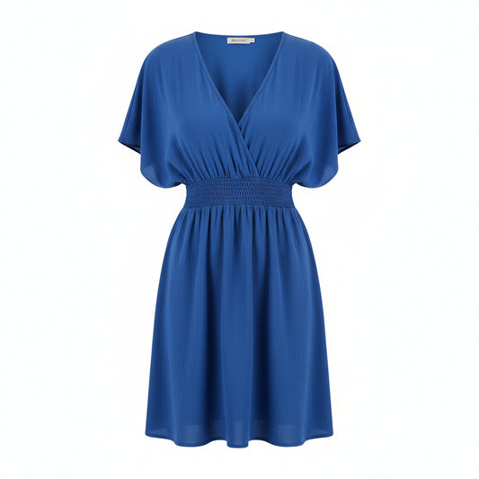 Woman wearing a blue dress on a white background