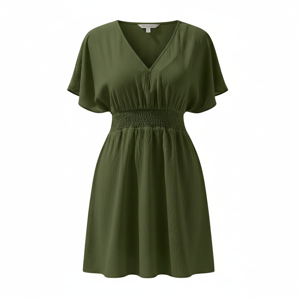 Green dress worn by a model on a white background