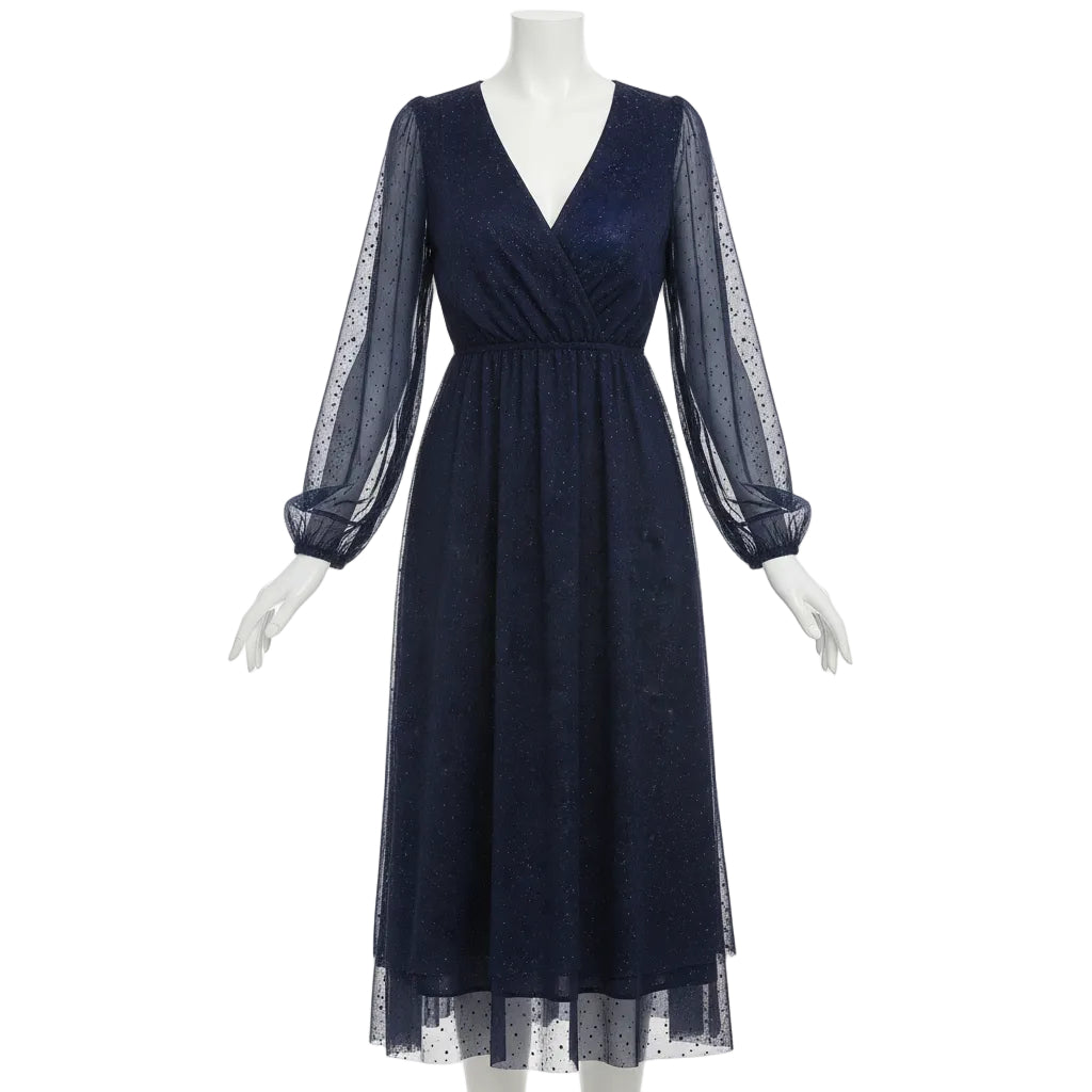 Woman wearing a navy blue dress with long sleeves in a festive indoor setting with Christmas trees.