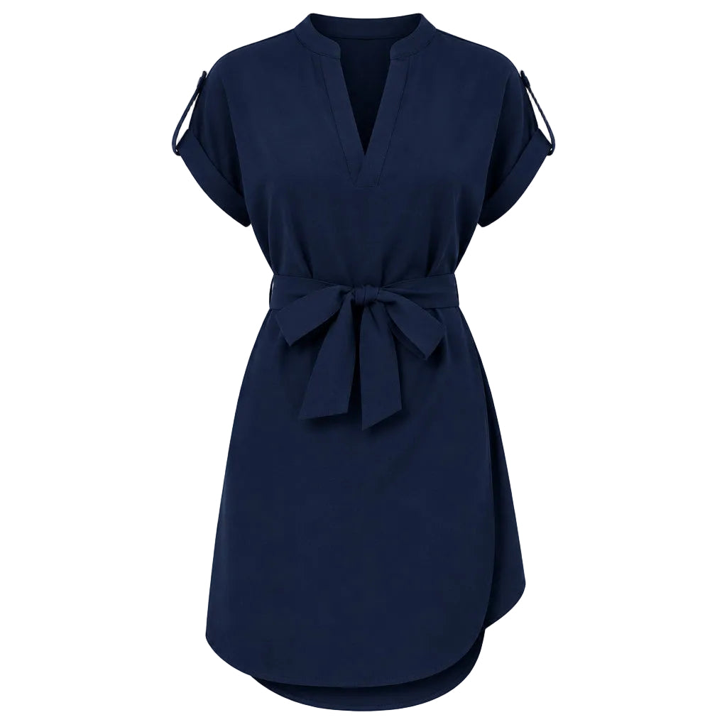 Woman wearing a navy blue dress with a belt on a white background