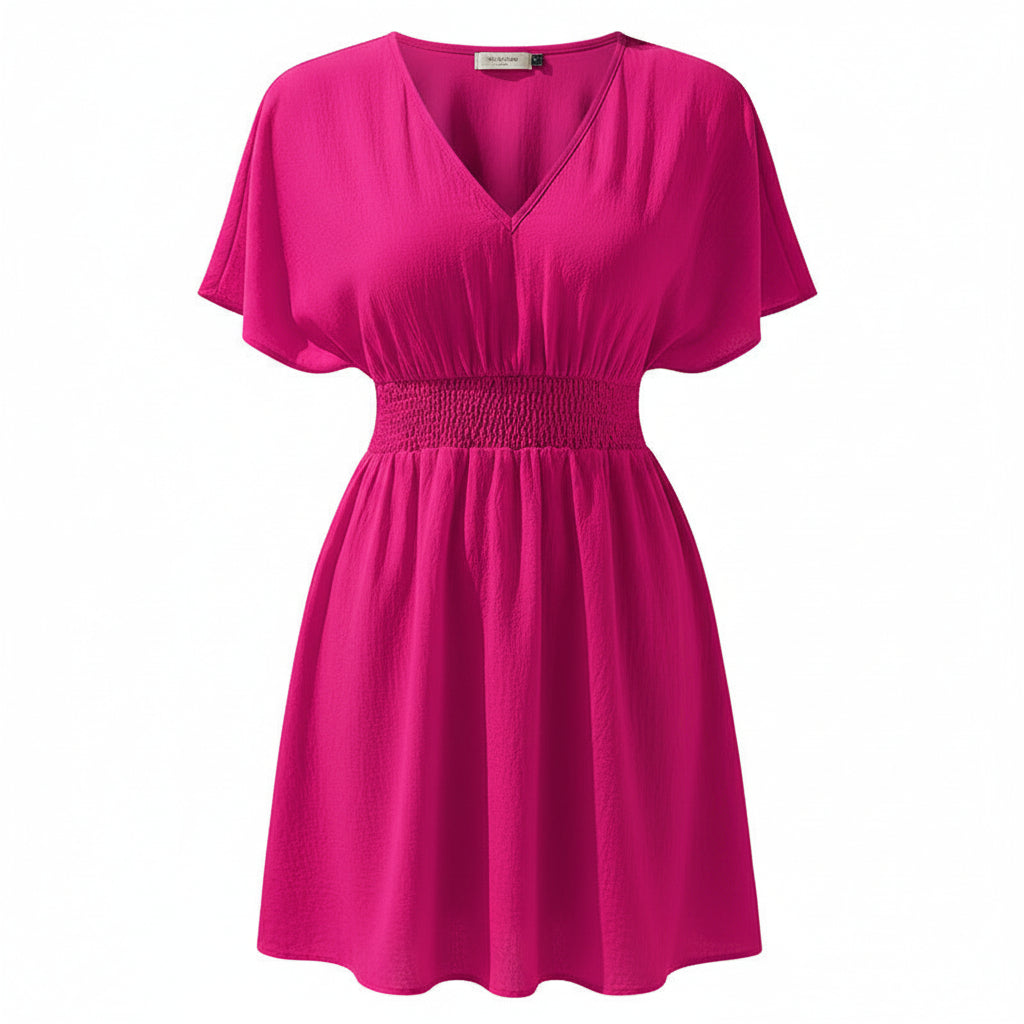 Woman wearing a bright pink dress on a white background