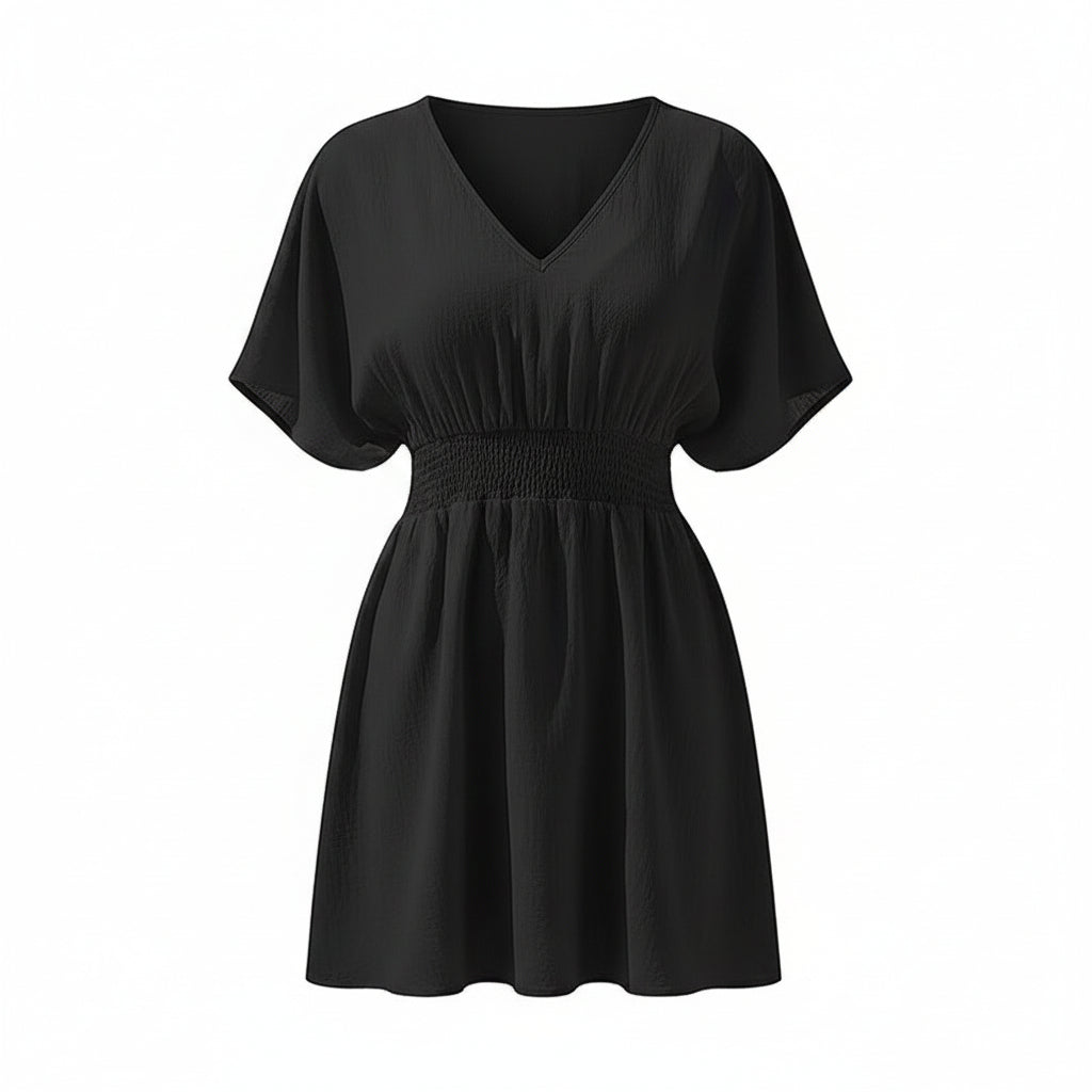 Black dress worn by a model on a white background