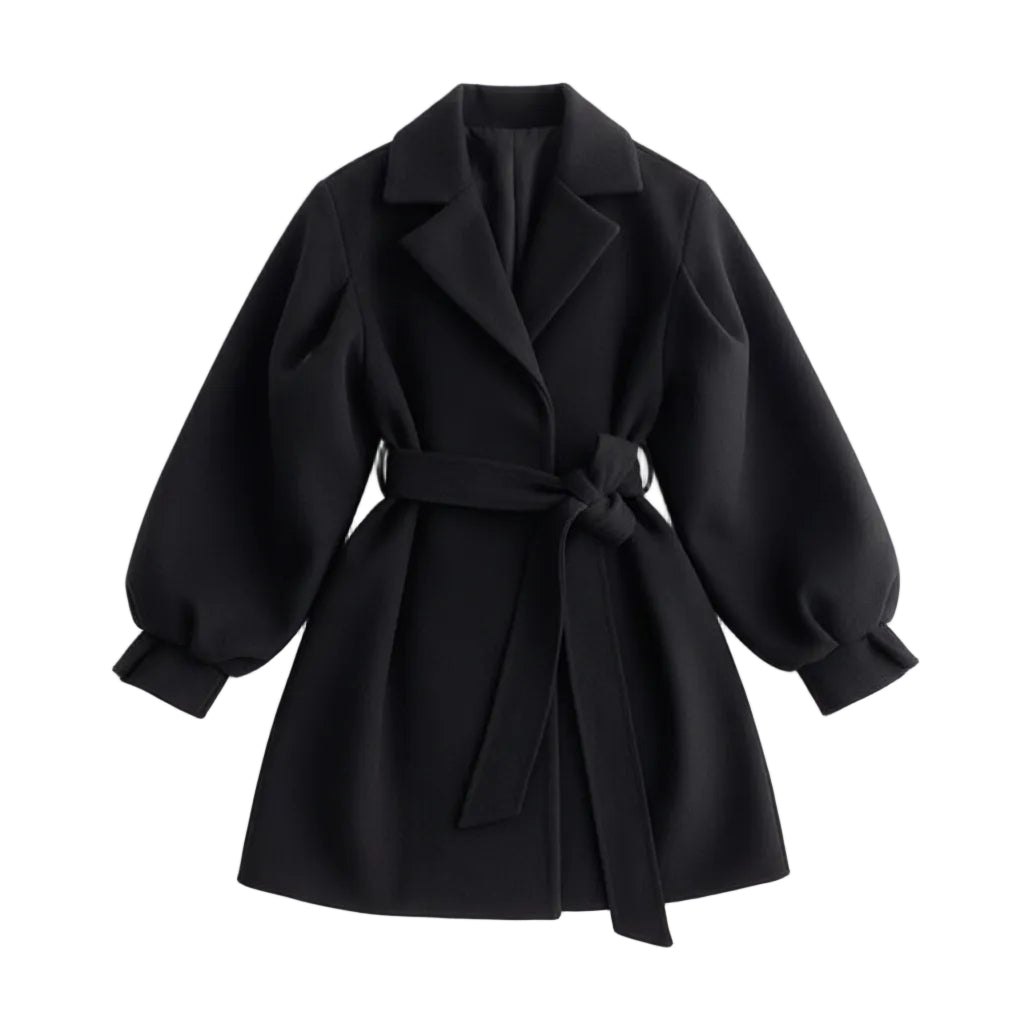 Person wearing a black coat with a belt on a plain background